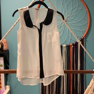 Sophisticated cream and black sleeveless blouse